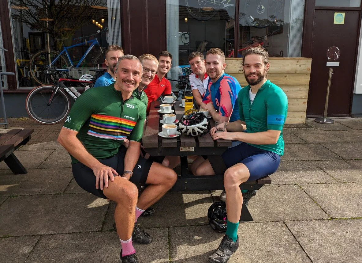 Out Velo riders sharing a cafe stop