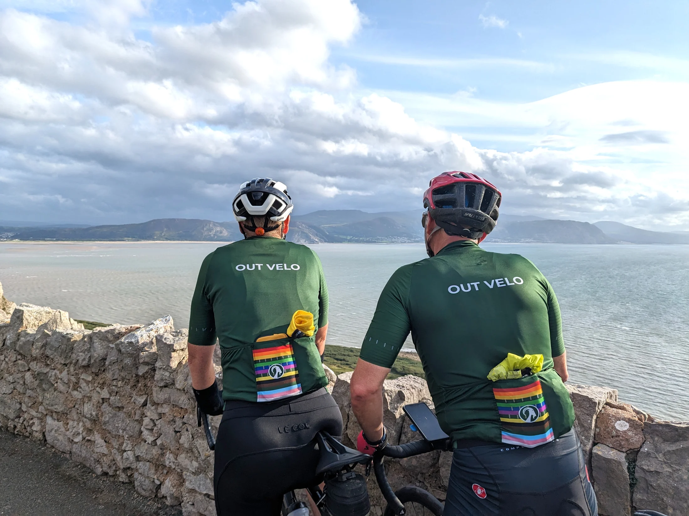 Two Out Velo riders overlooking the coast from the Great Orme