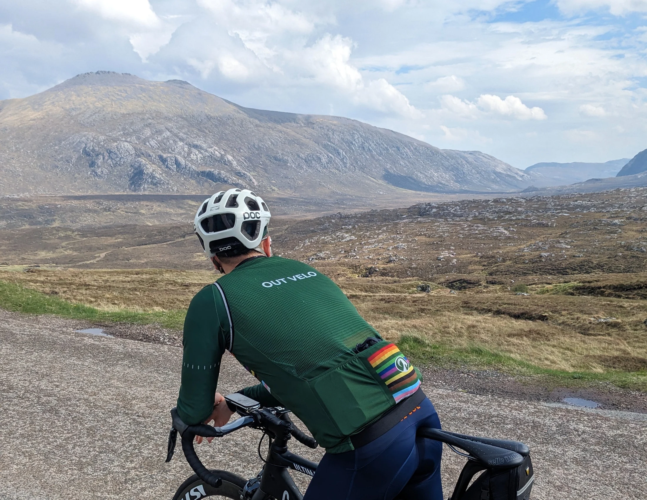 An Out Velo rider taking in a remote Highland landscape