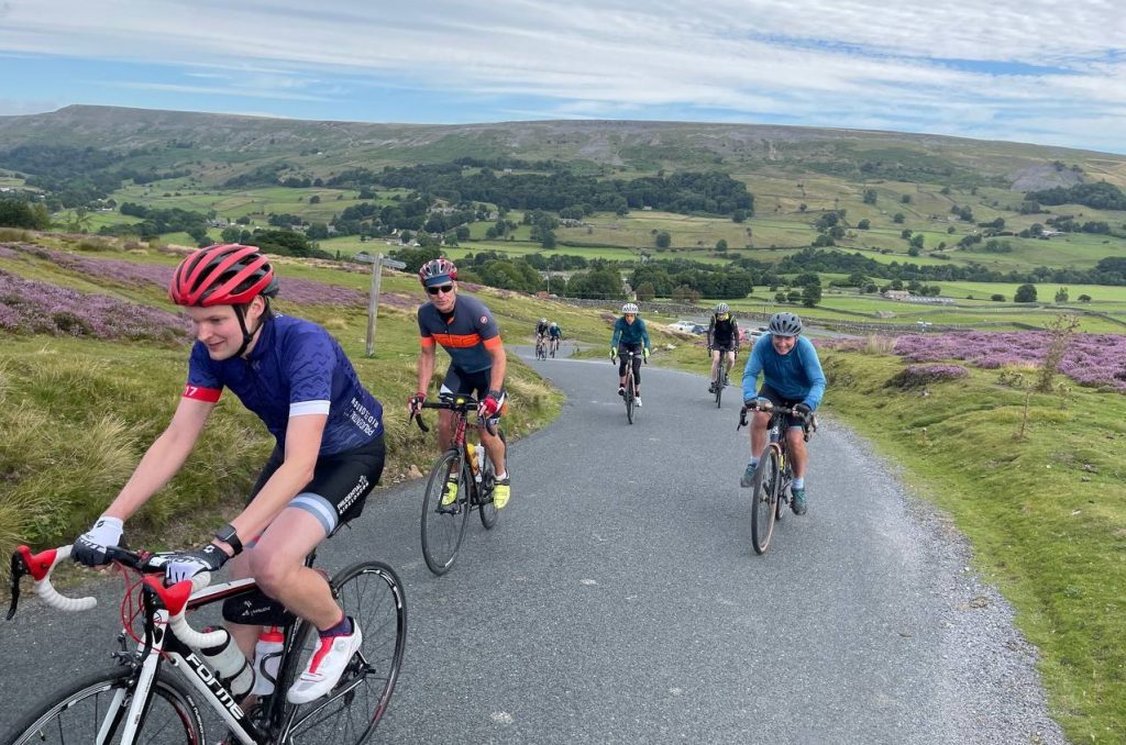 Cyclists riding through the Yorkshire Dales
