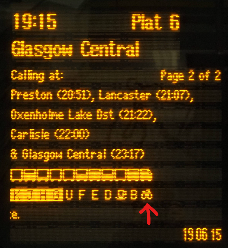 Train platform display with the bicycle symbol marking the bike carriage